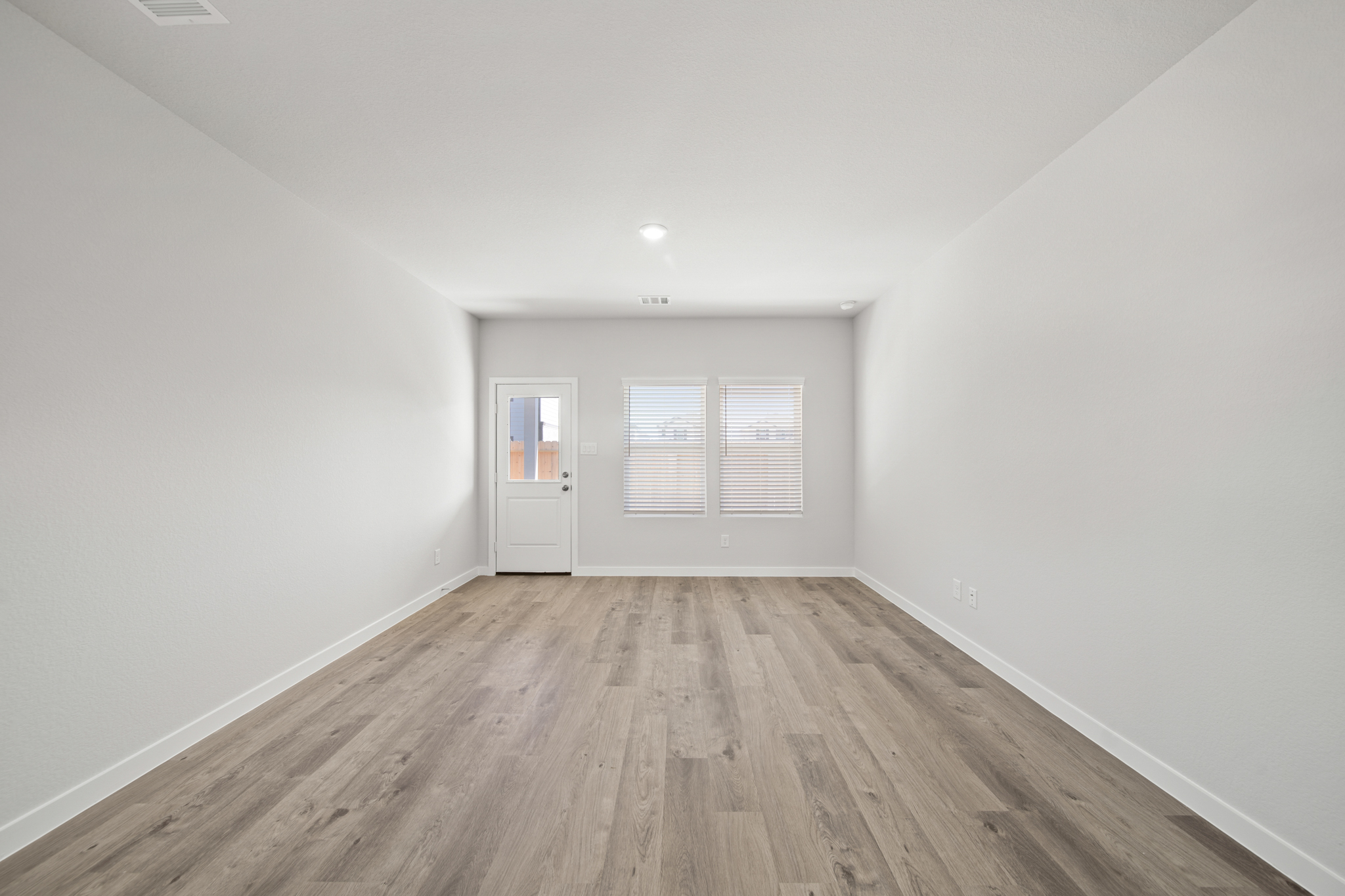 A room with a wood floor and a wood floor.
