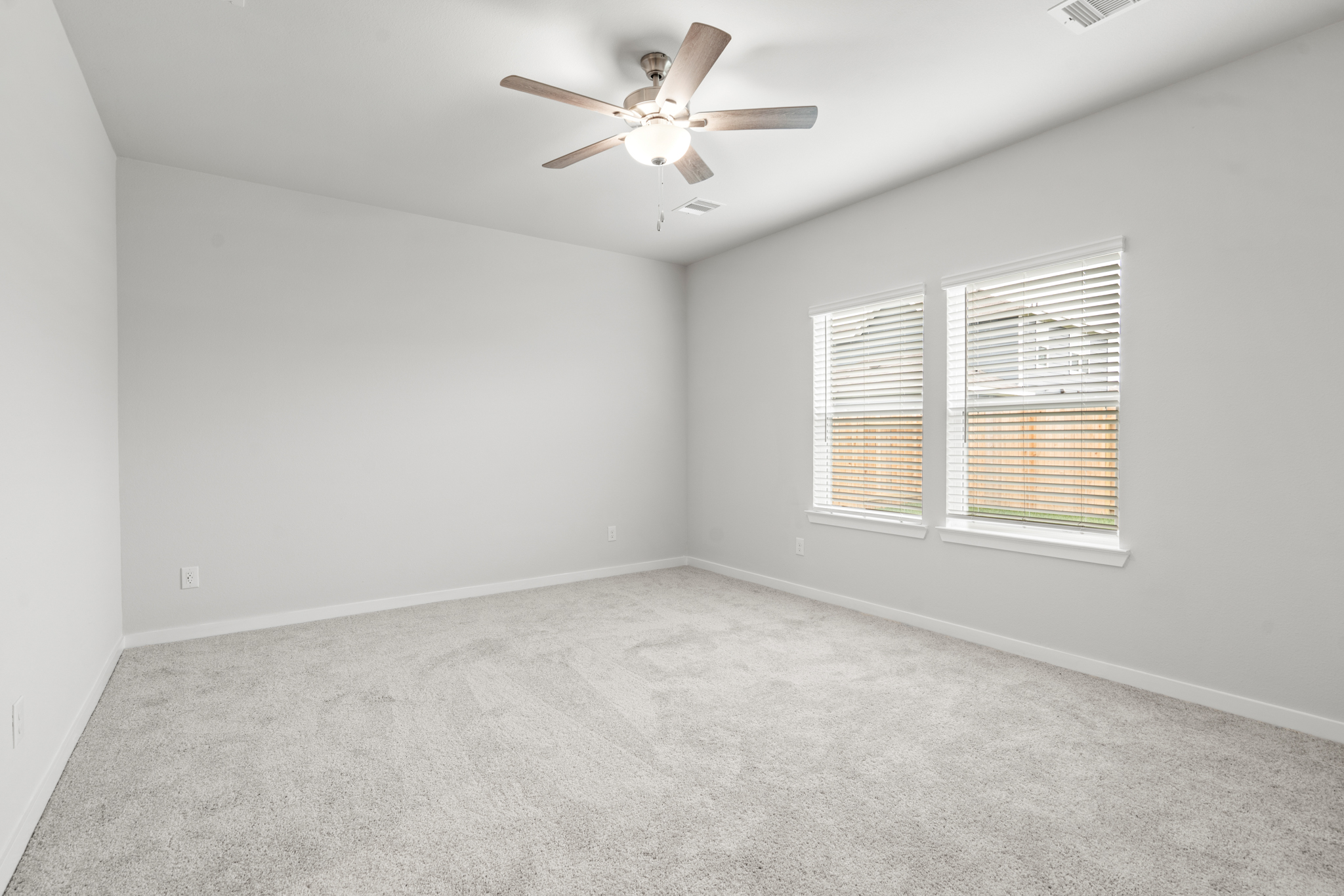 A ceiling fan in a room.
