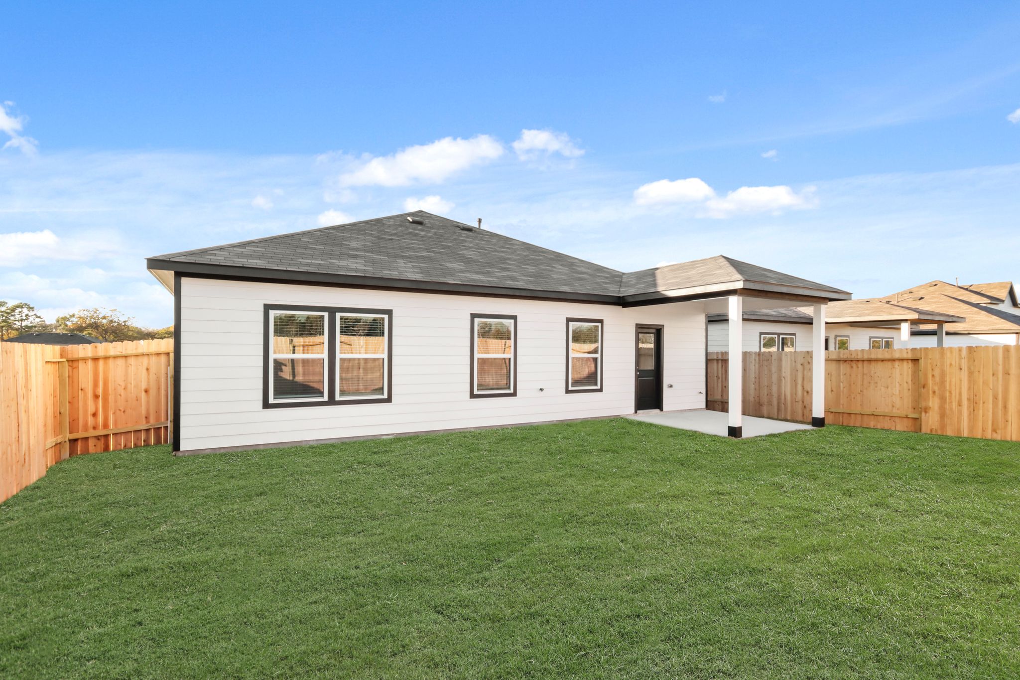 A house with a fence around it.