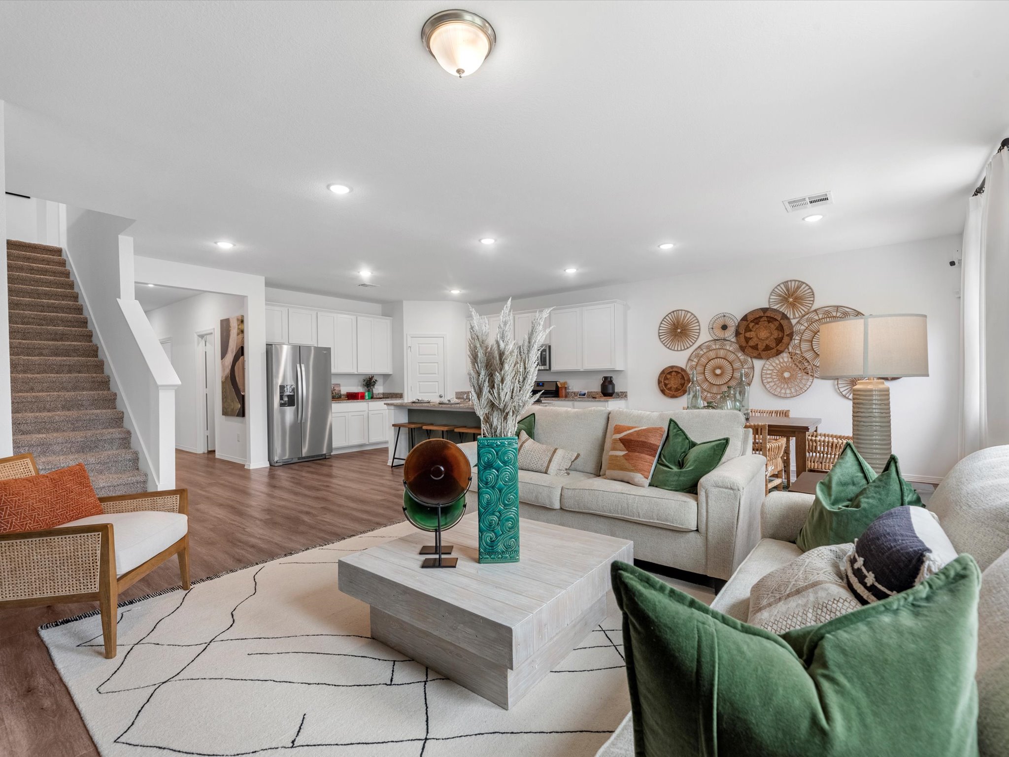 A living room with a staircase.