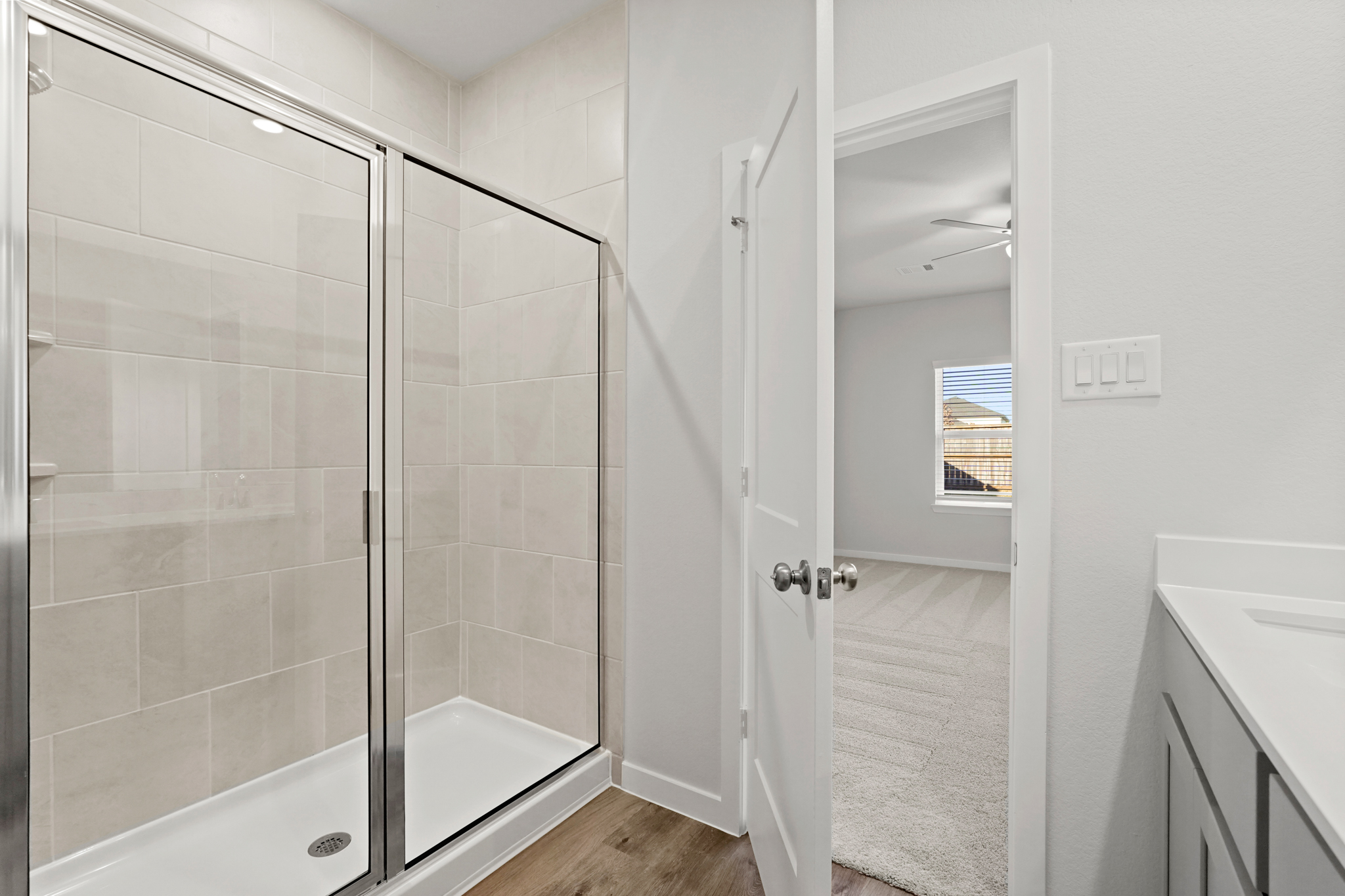 A bathroom with a glass shower.
