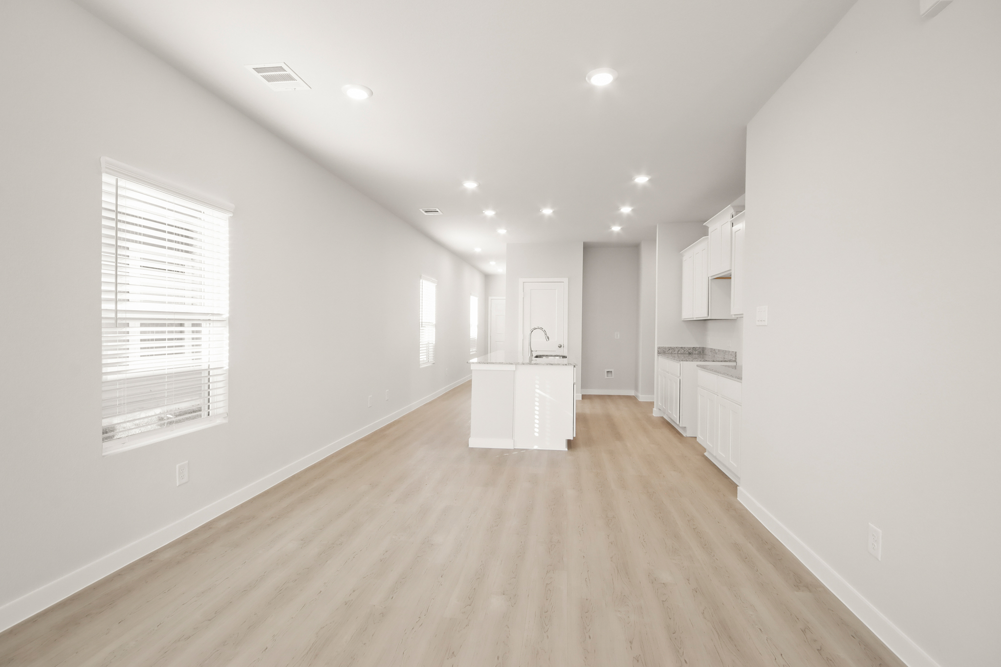 A room with white cabinets.