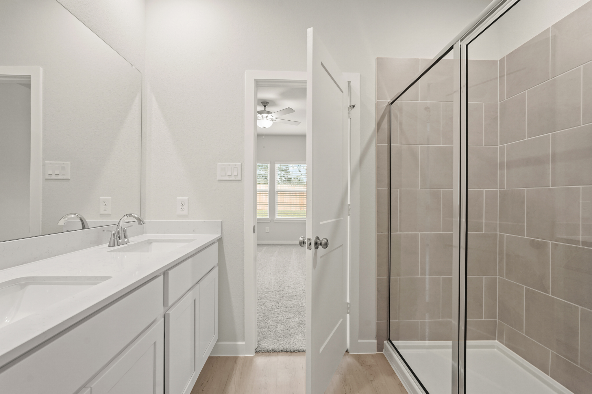 A bathroom with a glass shower.