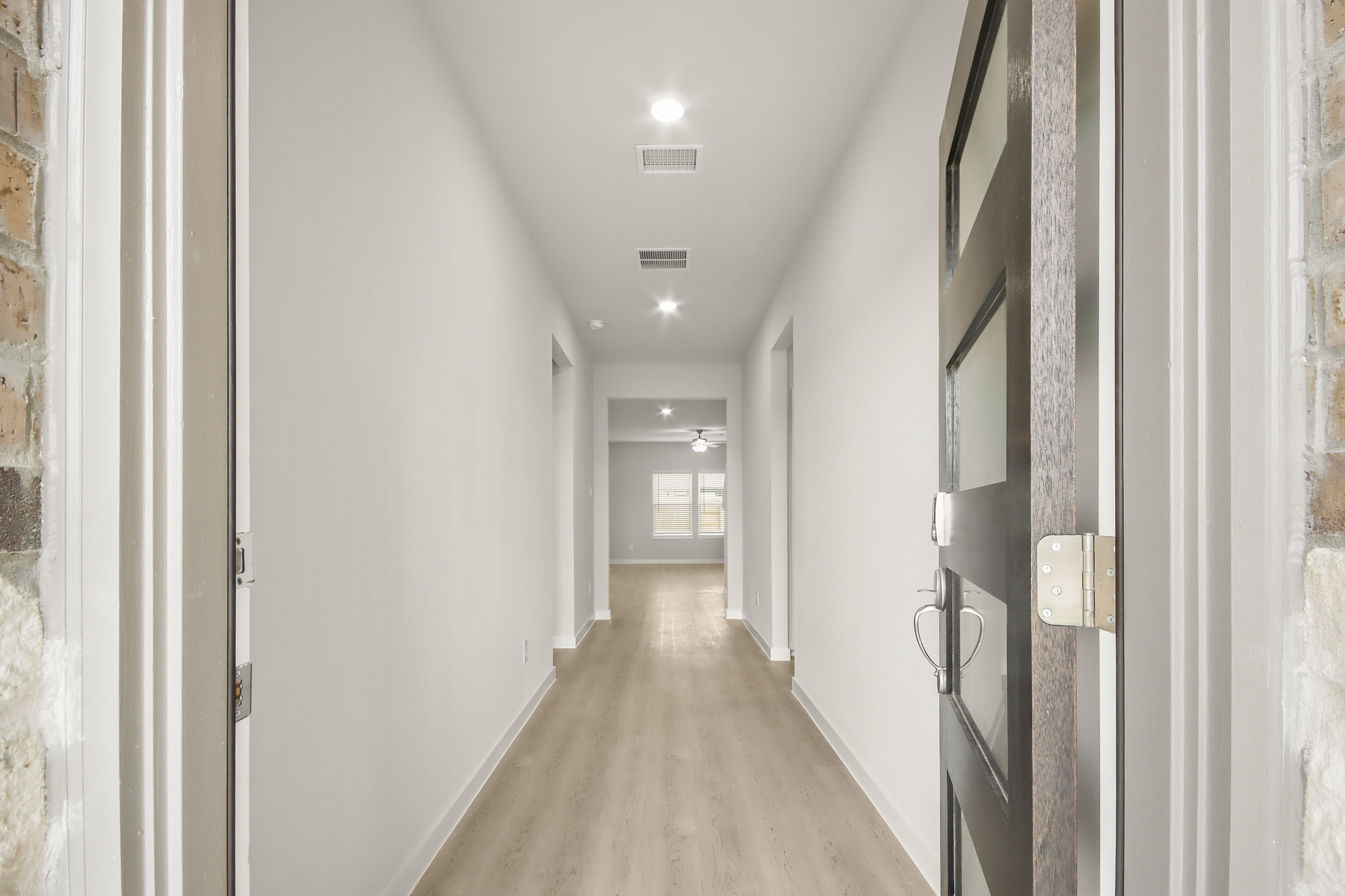 A hallway with white walls.