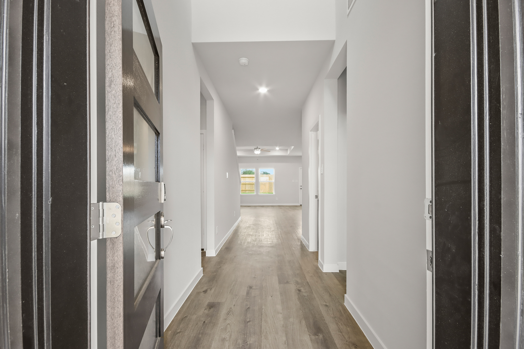 A hallway with white walls.