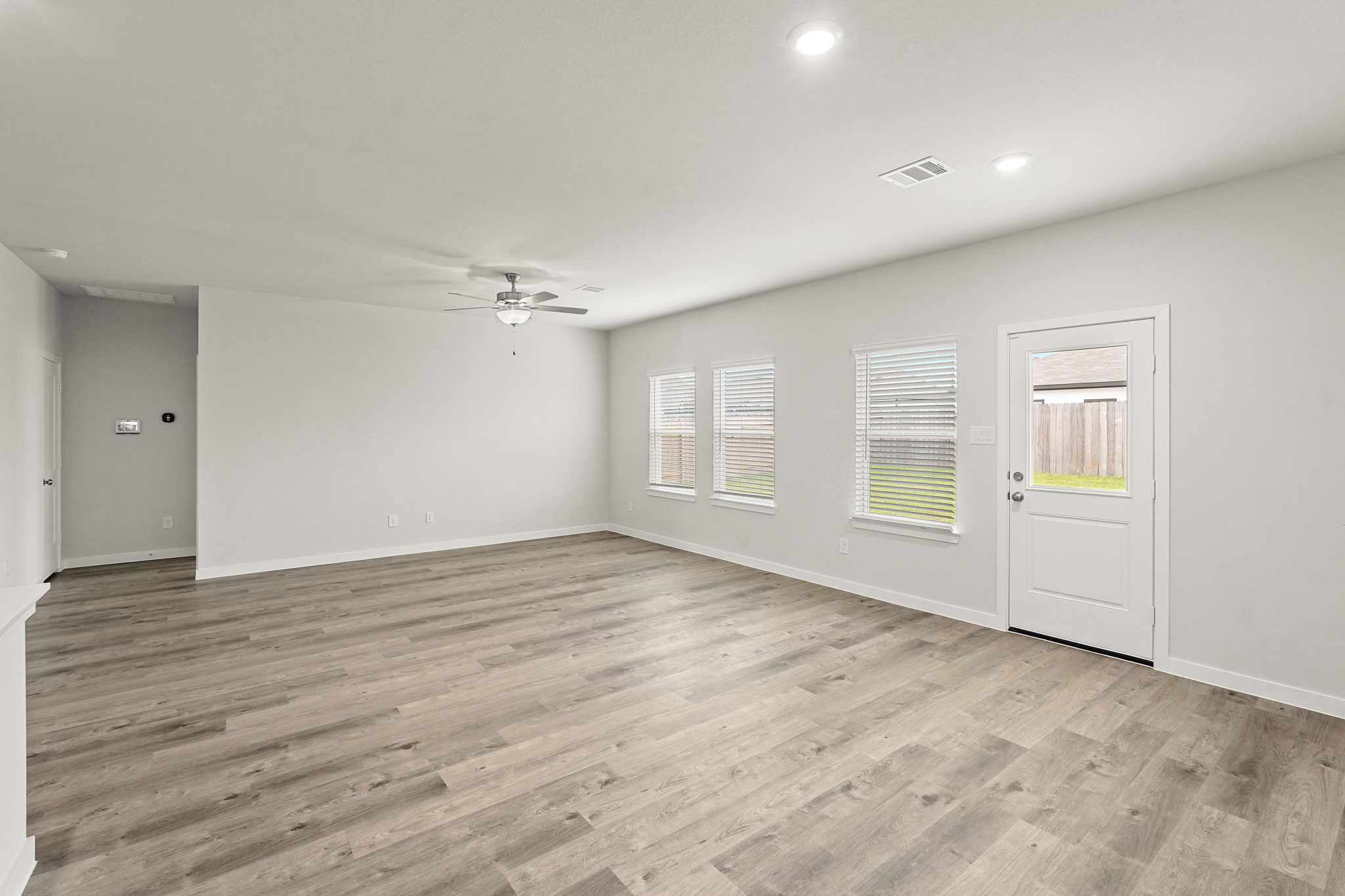 A room with a wood floor and a wood floor.