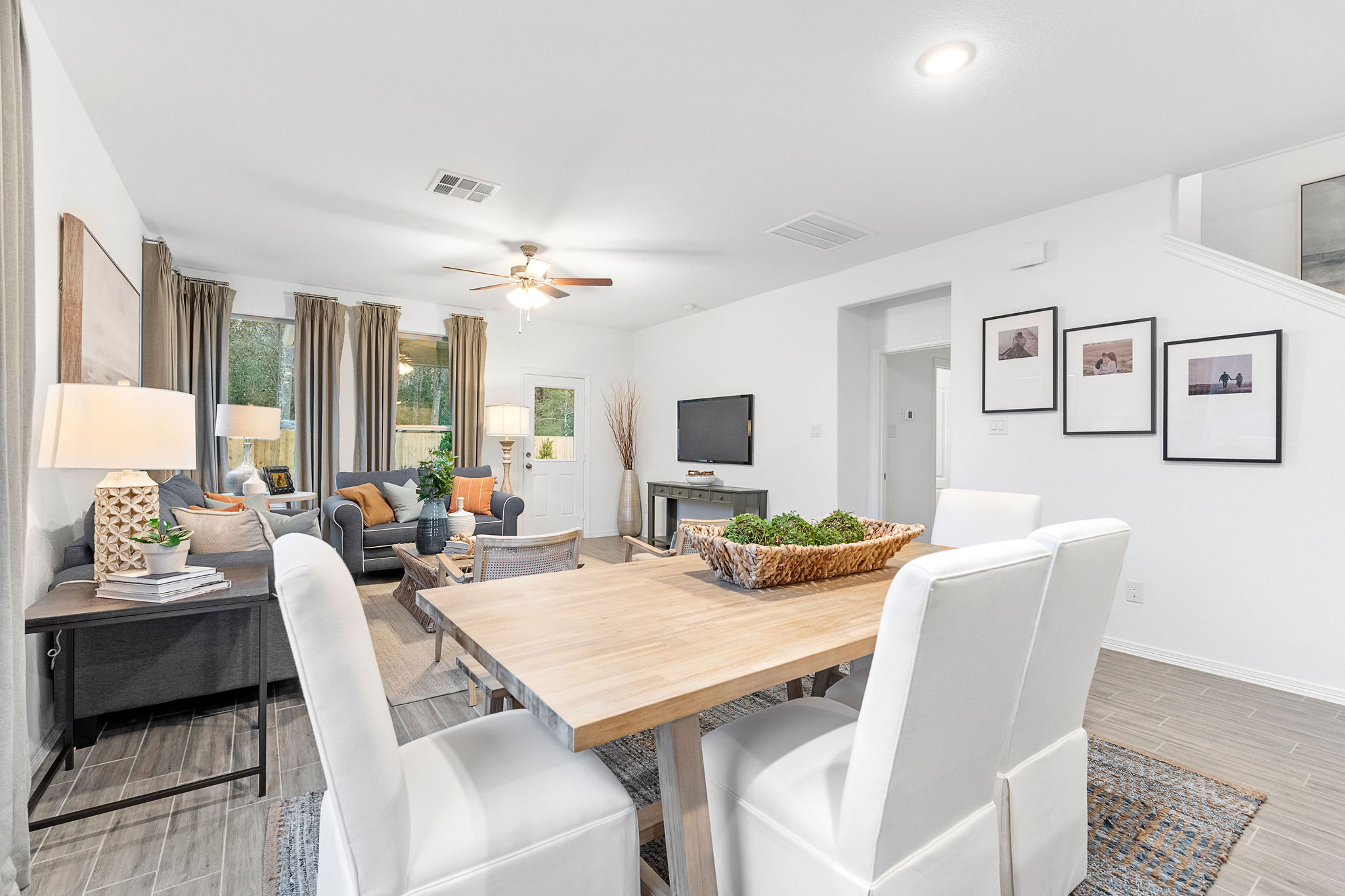 A dining room with a table and chairs.