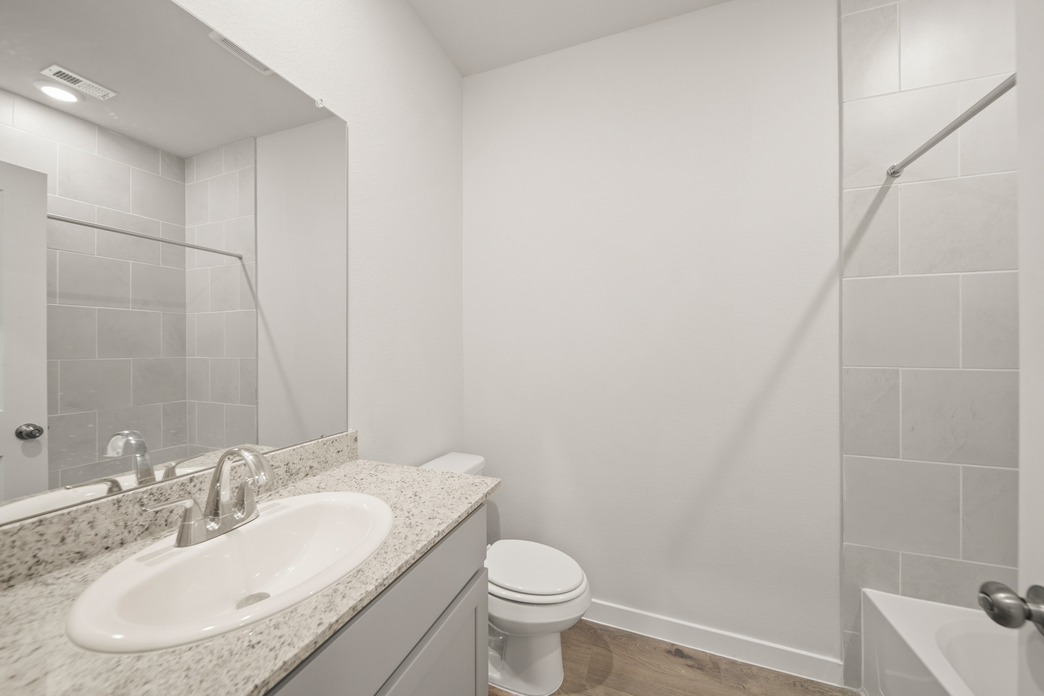 A bathroom with a sink and a toilet.