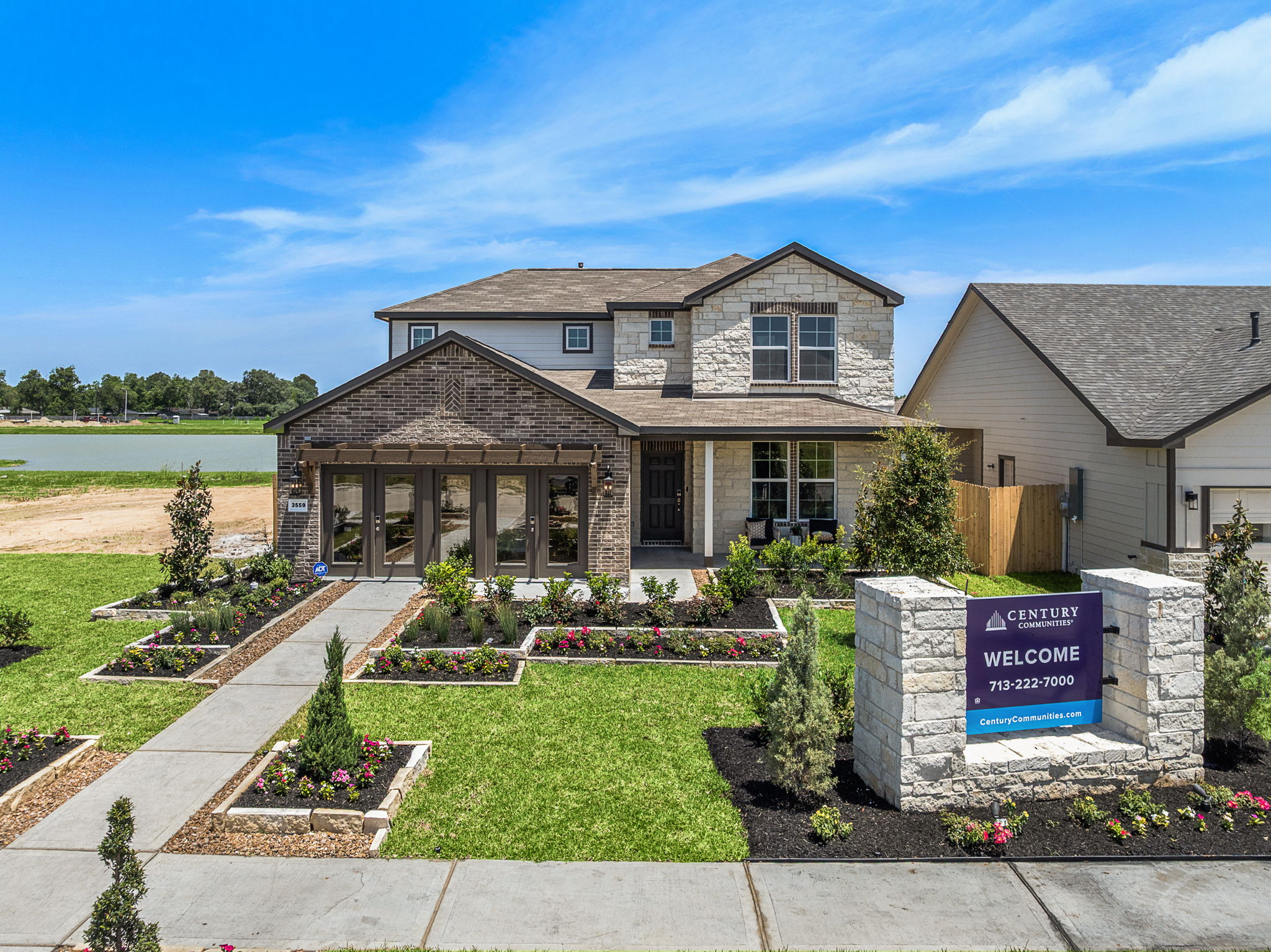 A house with a sign in front.