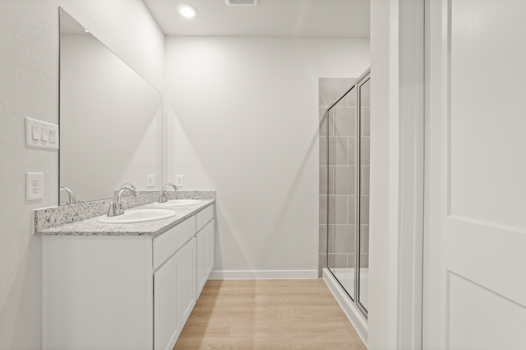 A bathroom with a glass shower.