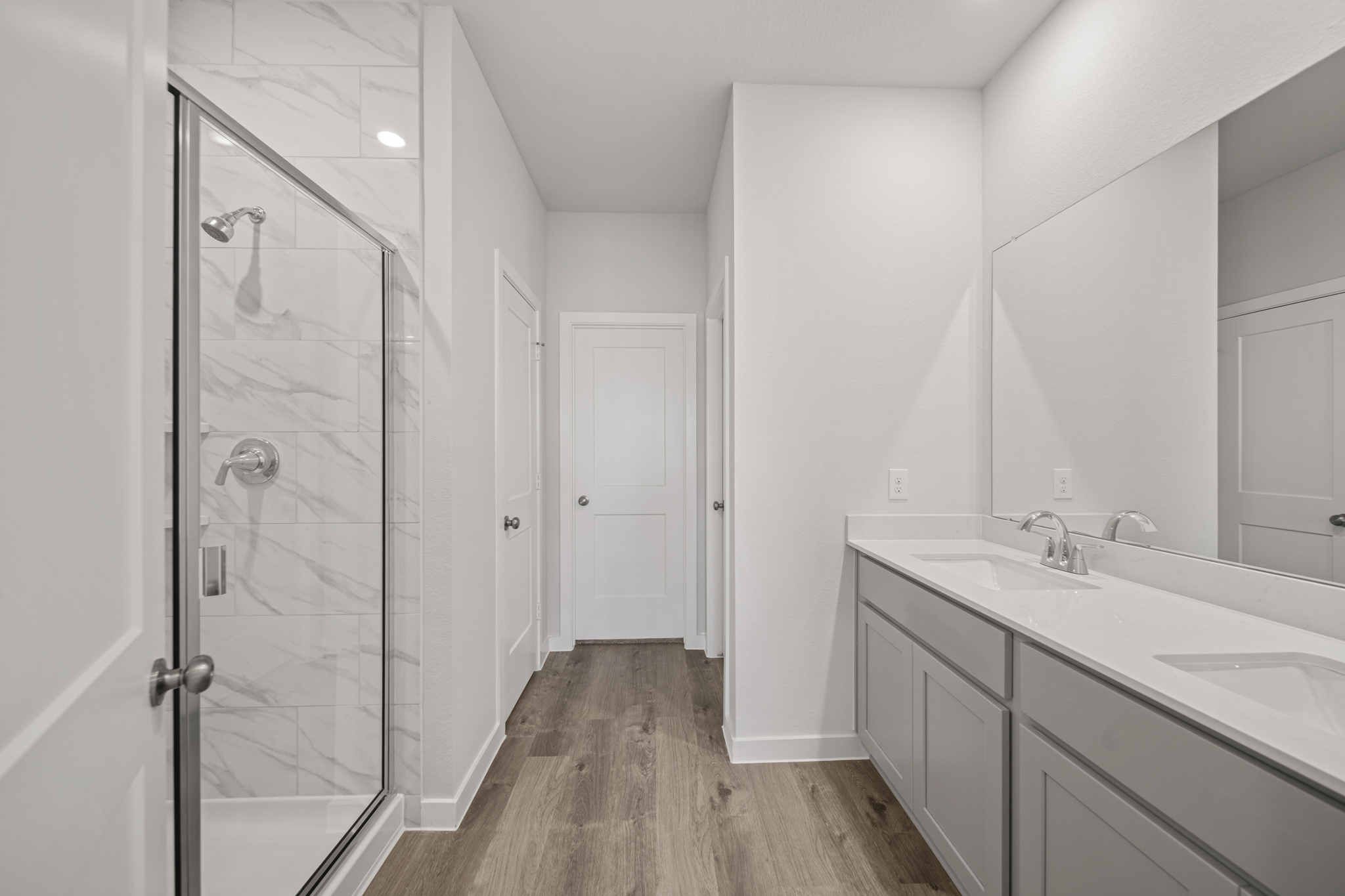 A bathroom with a glass shower.