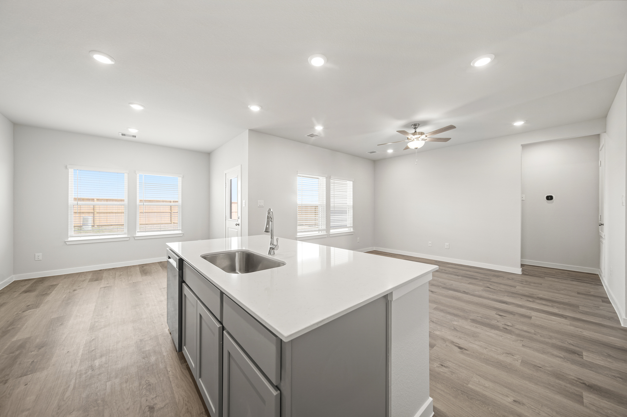 A kitchen with a sink and cabinets.