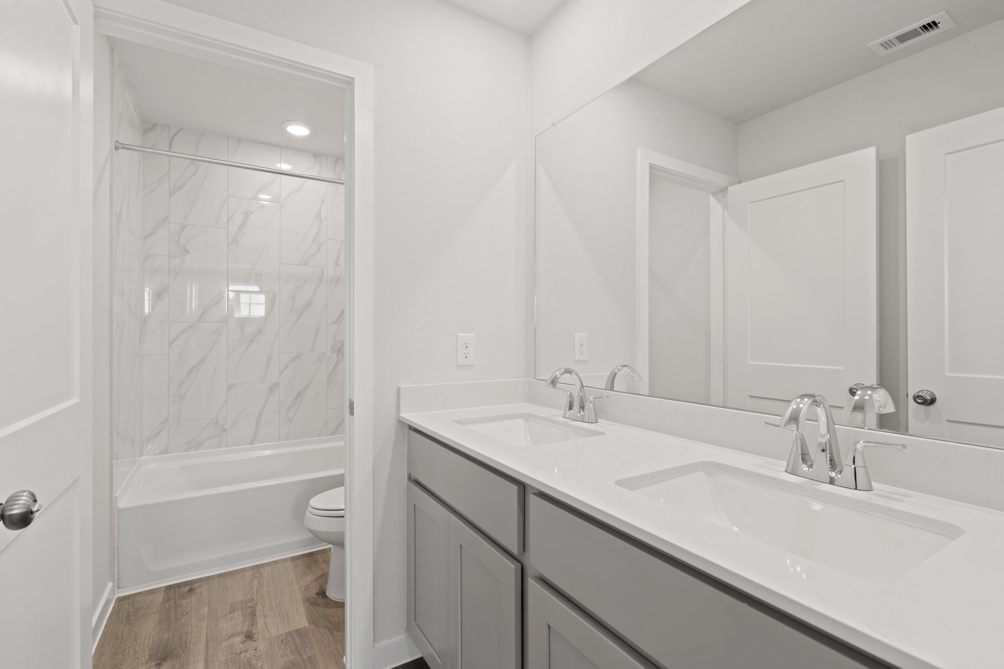 A bathroom with a glass shower.