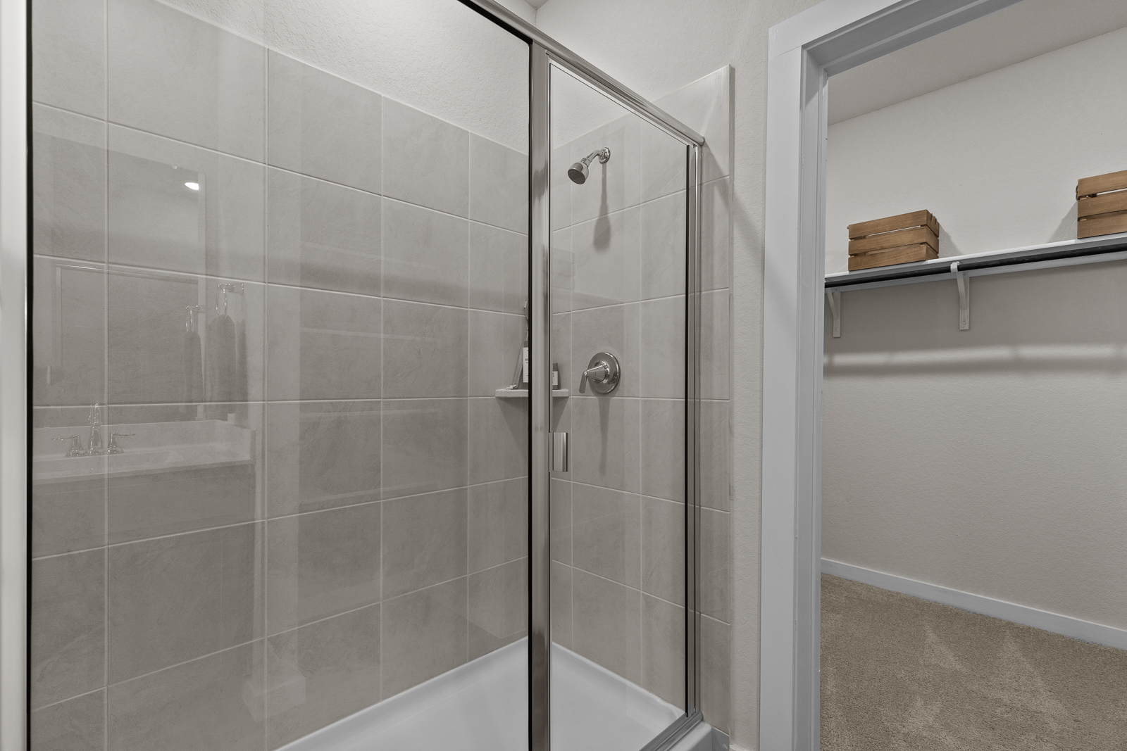 A shower with a glass door.