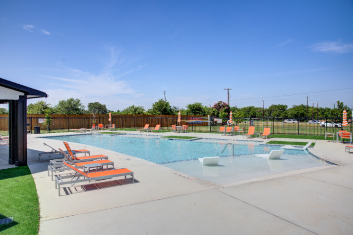 A swimming pool with a fence around it.