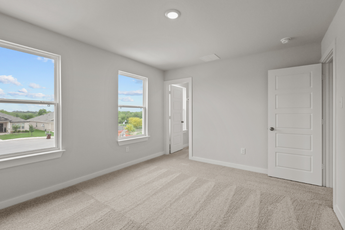 A room with a window and a door.