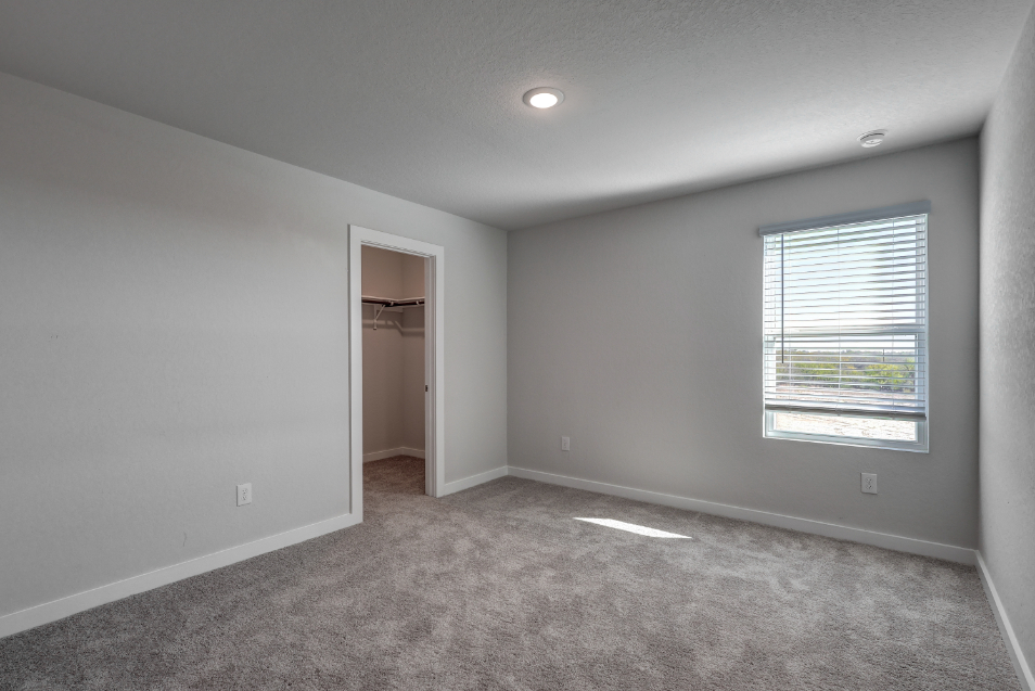 A room with a door and a window.