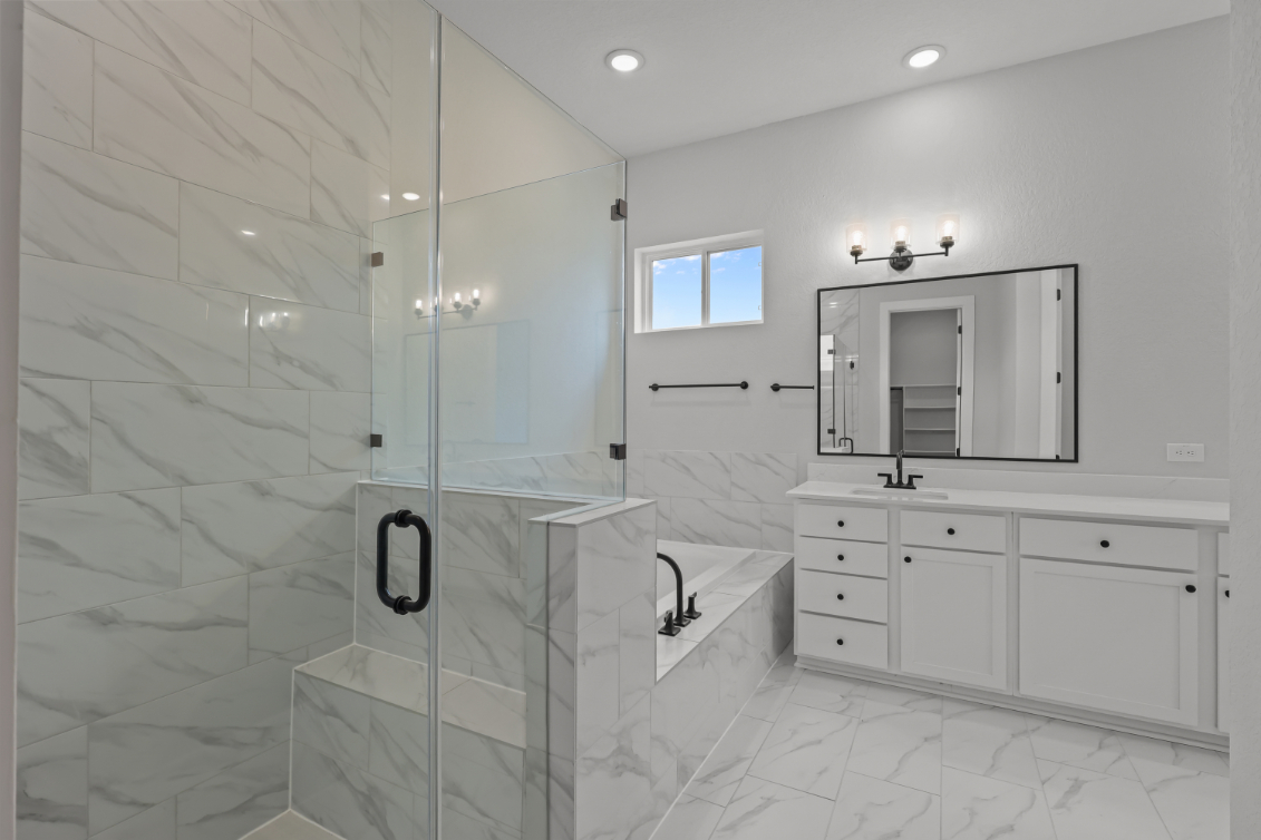 A bathroom with a glass shower.