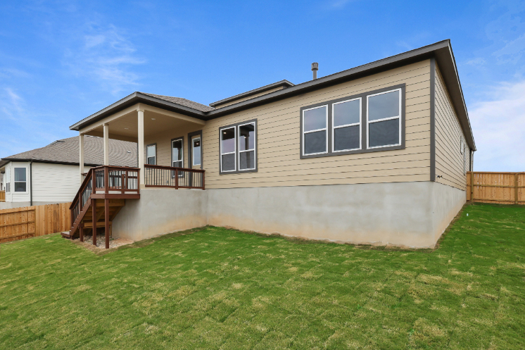 A house with a grass yard.