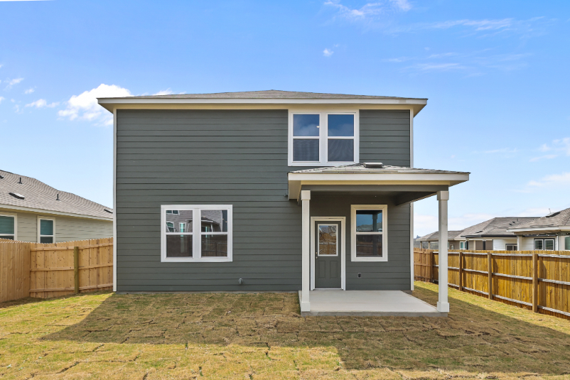 A house with a fence around it.