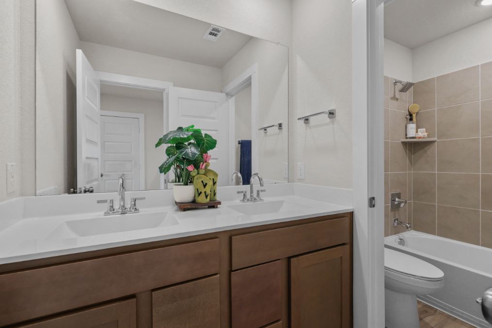 A bathroom with a sink and a toilet.