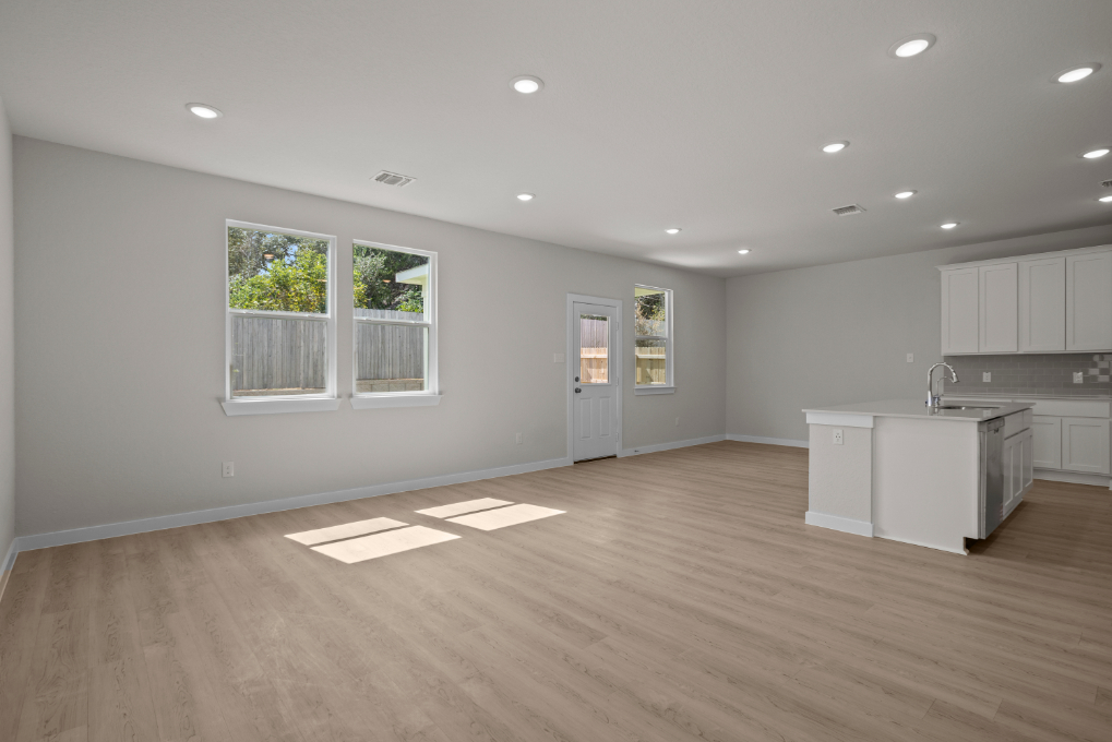 A large kitchen with white cabinets.