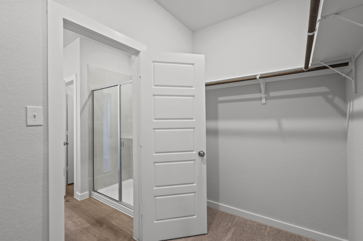 A white closet in a room.