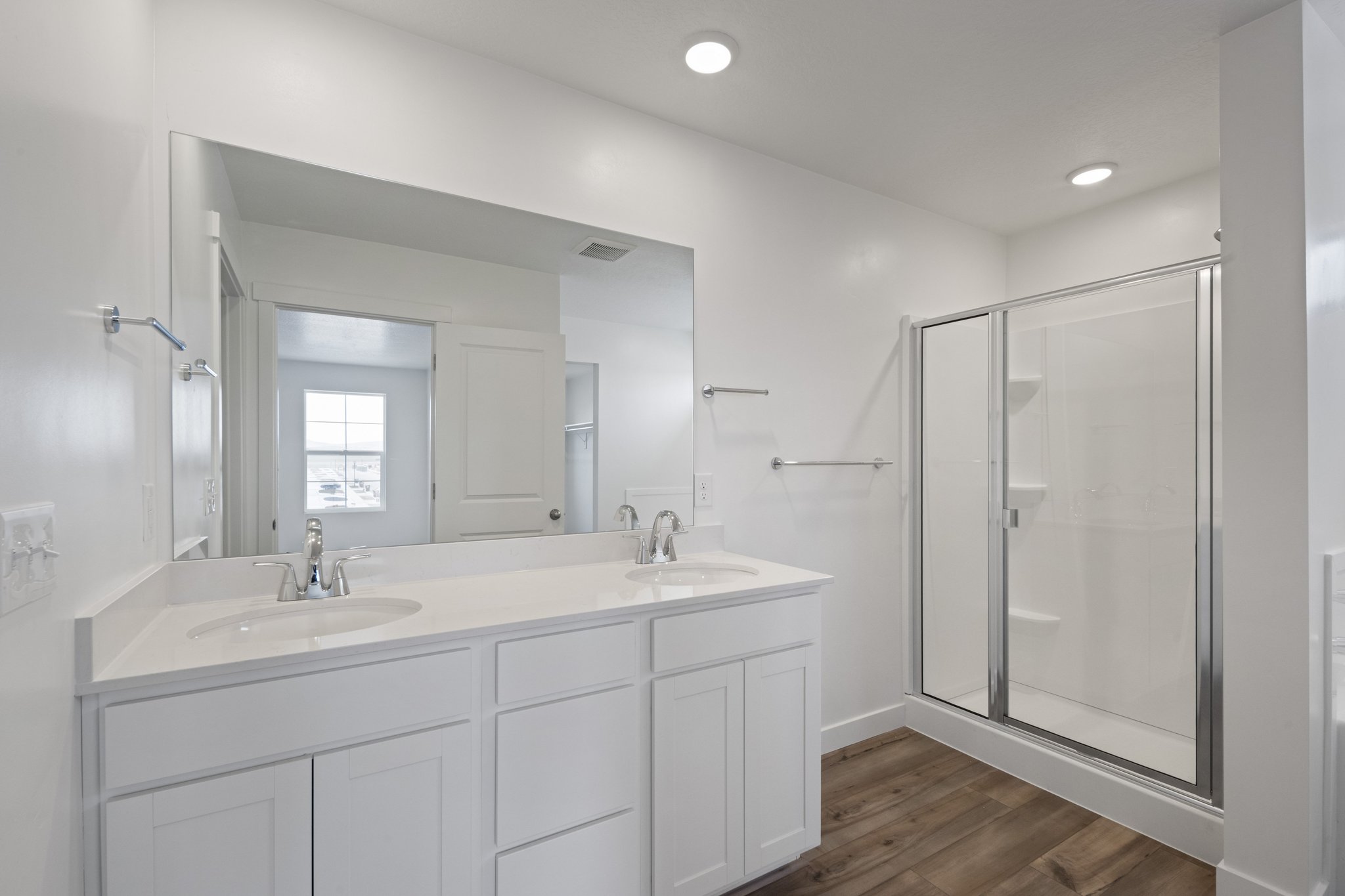 A bathroom with a glass shower.