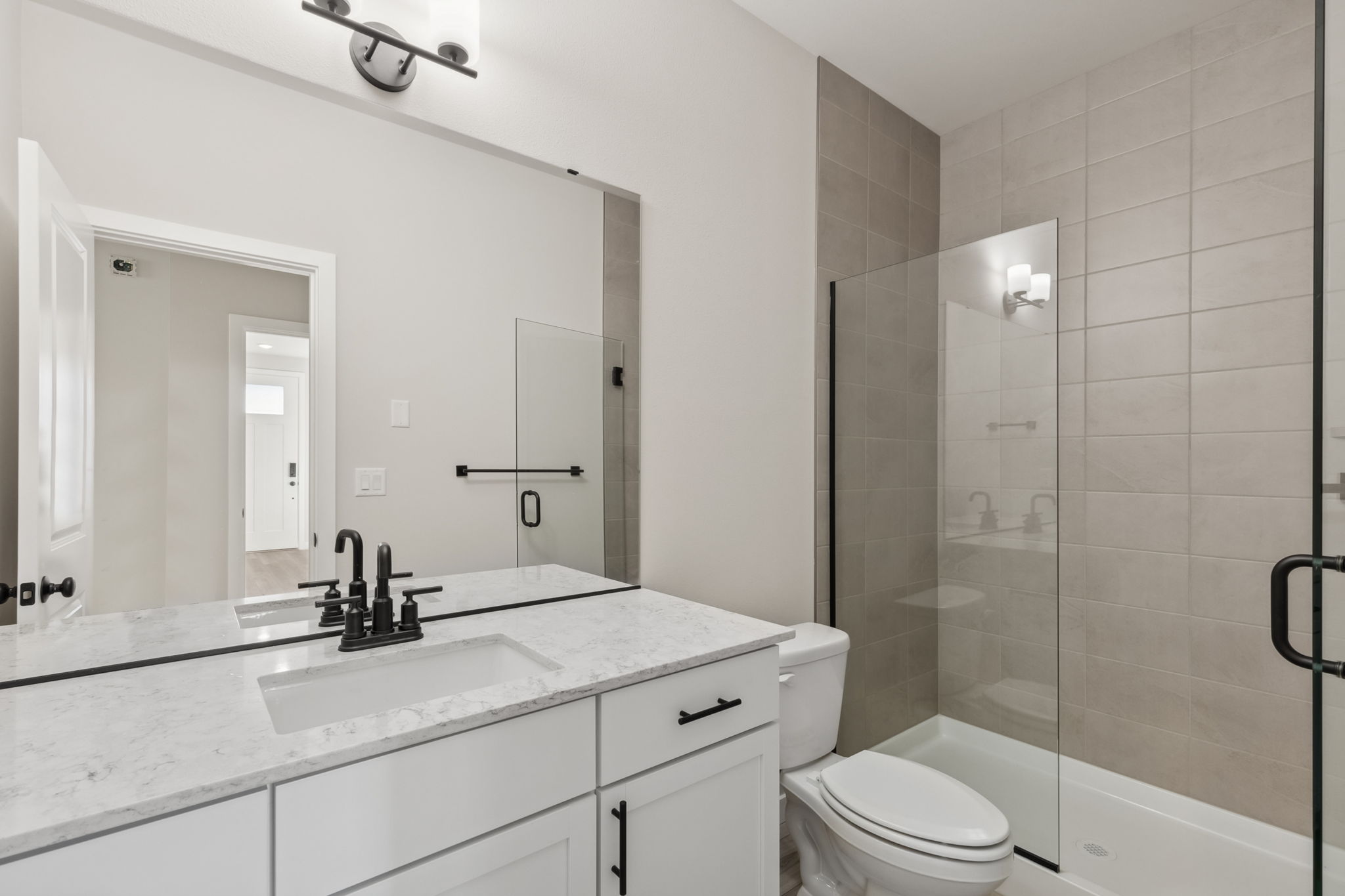 A bathroom with a glass shower.