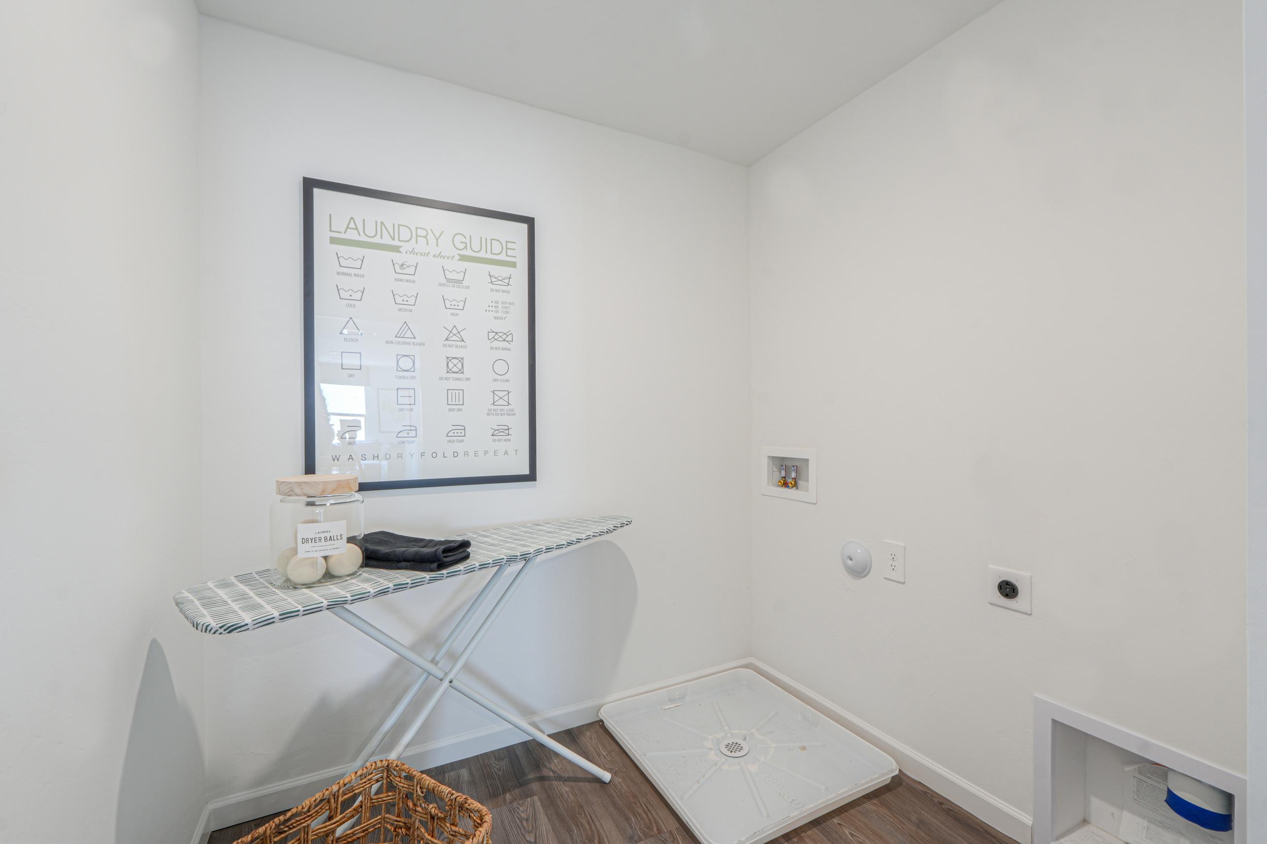 A room with a table and a whiteboard.