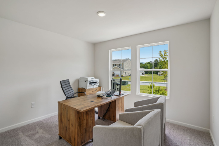 A room with a desk and chair.