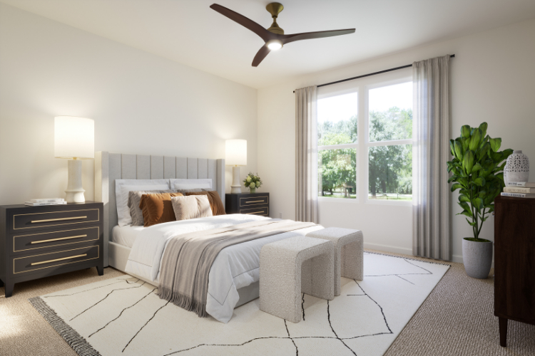 A bedroom with a bed and a fan.