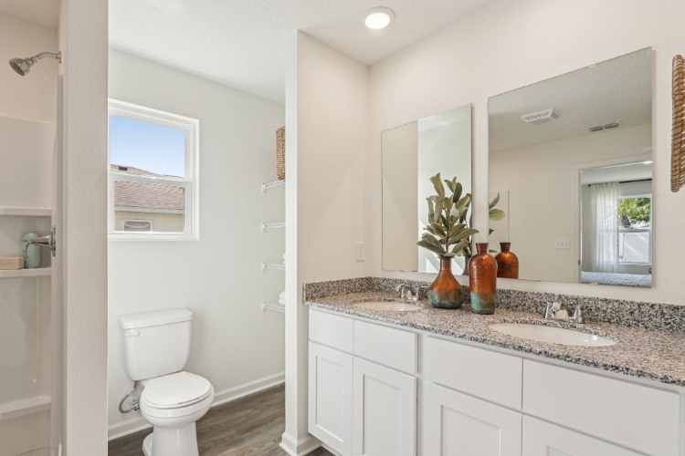 A bathroom with a marble countertop.