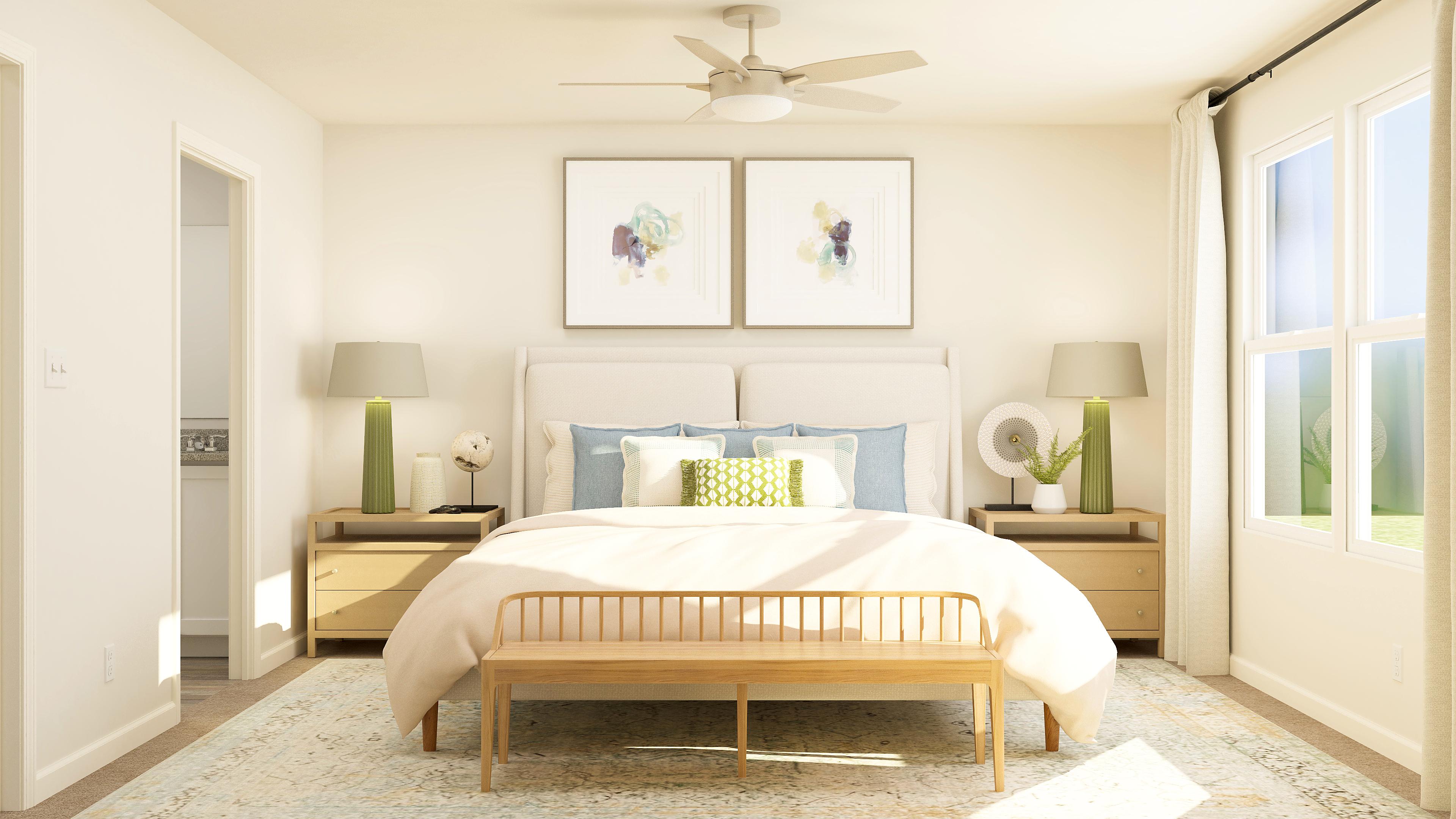 A bedroom with a bed and lamps.