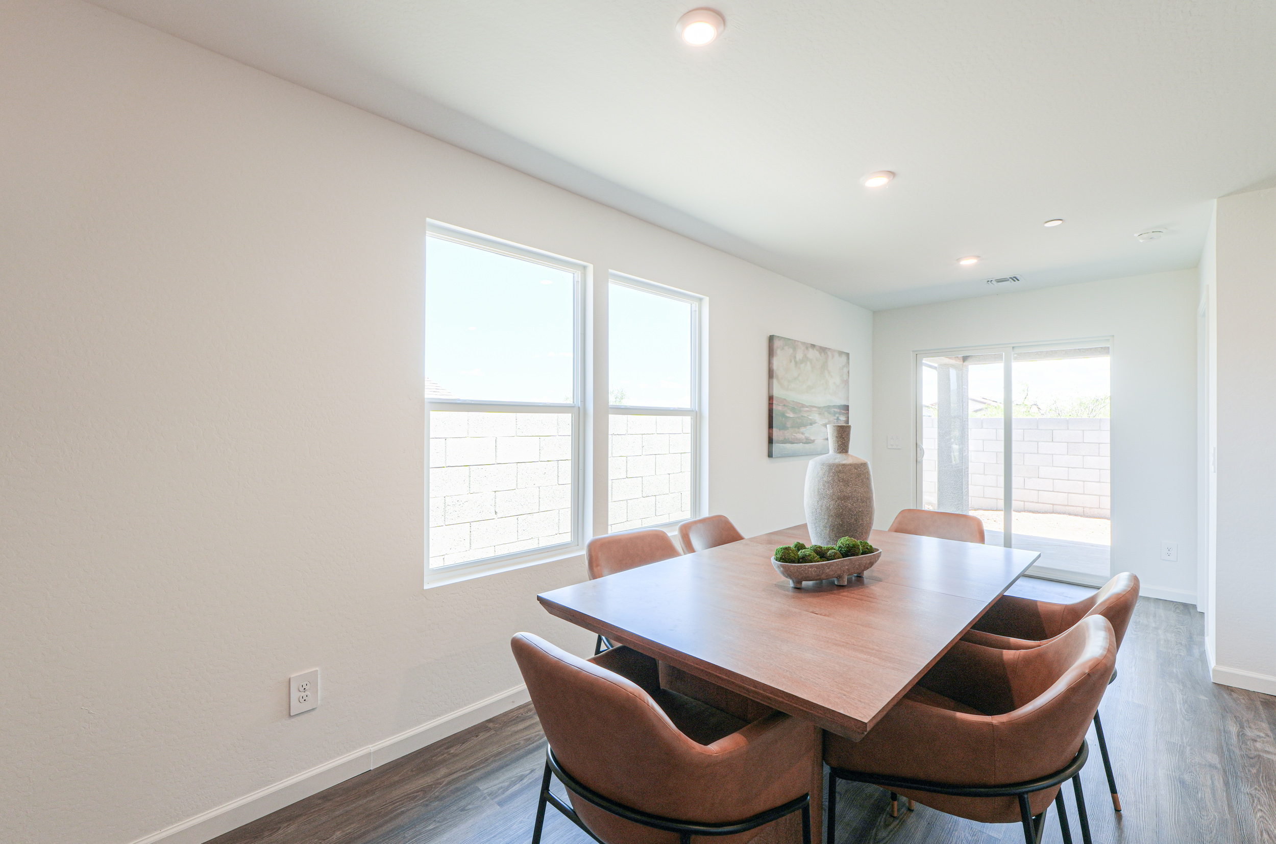 A dining room table with chairs.