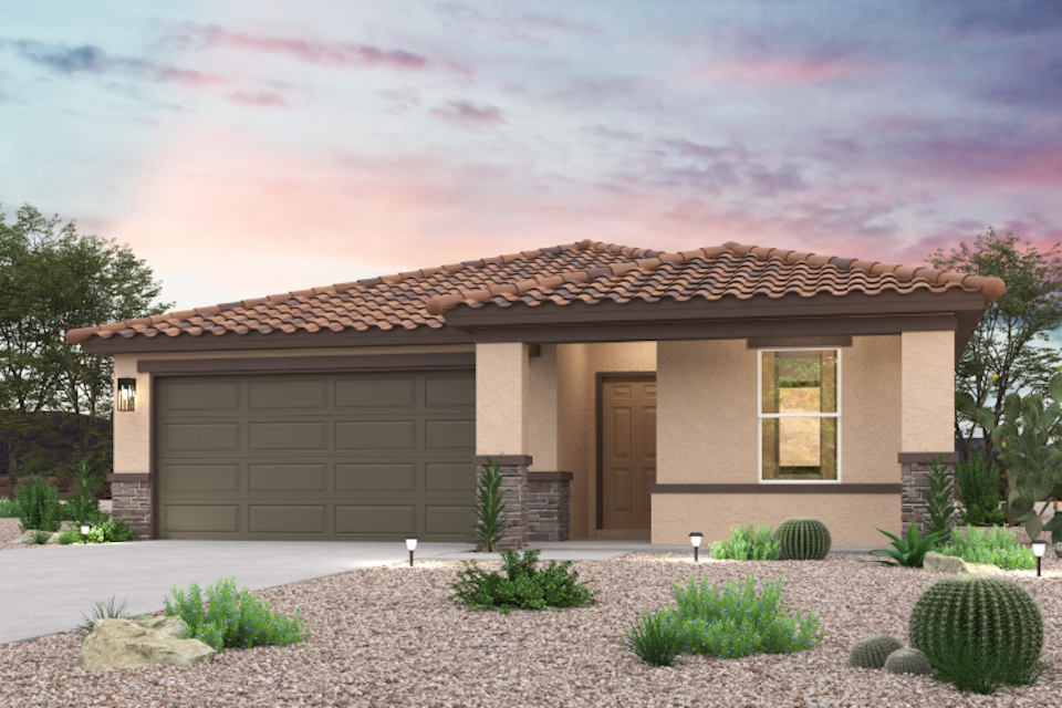A house with a garage and bushes.