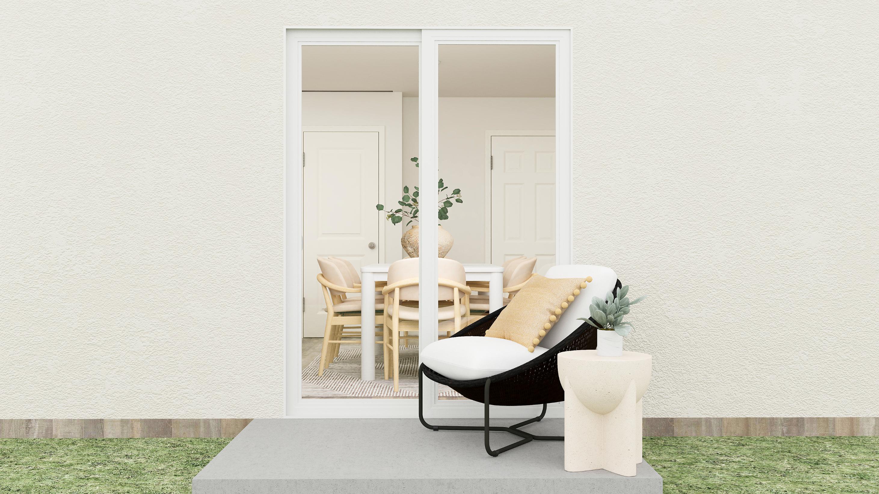 A room with a table chairs and a door.