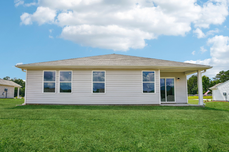 A house with a grass yard.