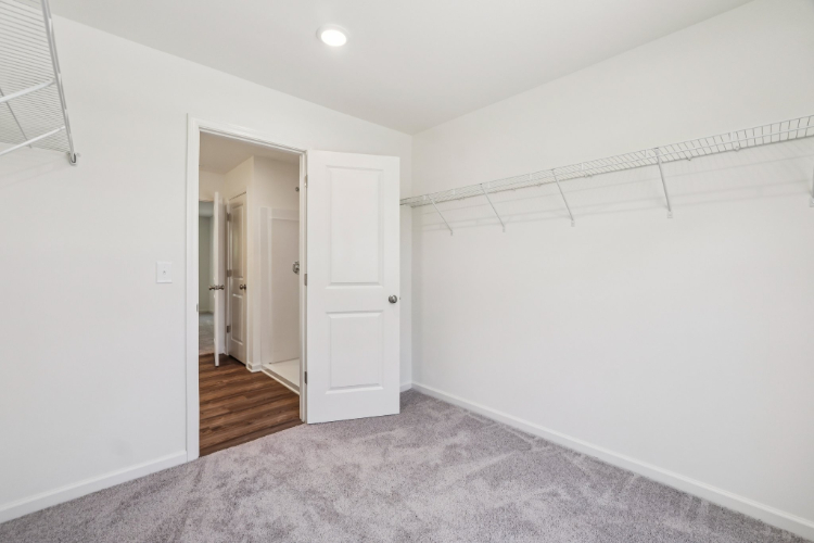 A hallway with white walls.