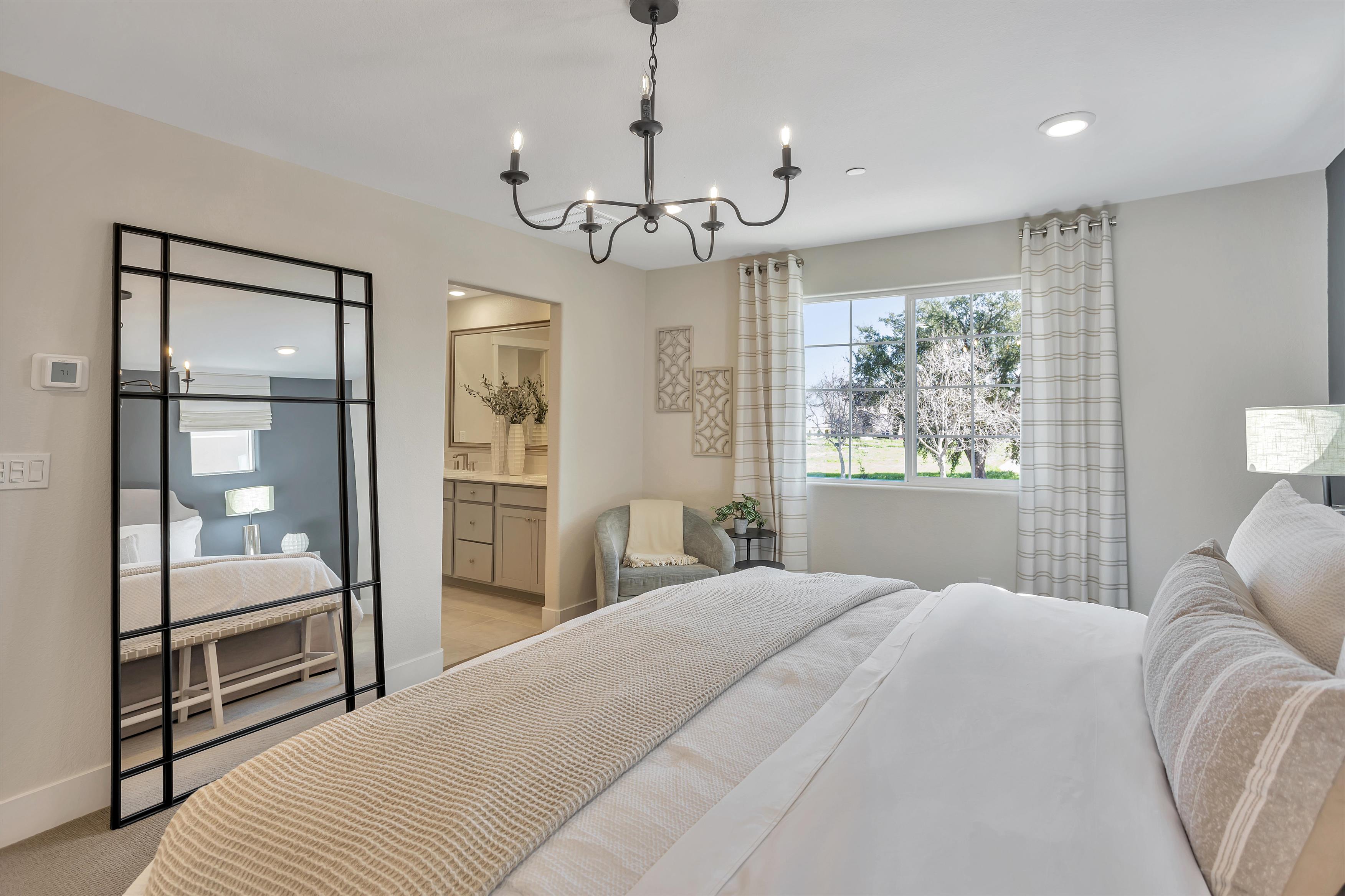 A bedroom with a large glass door.