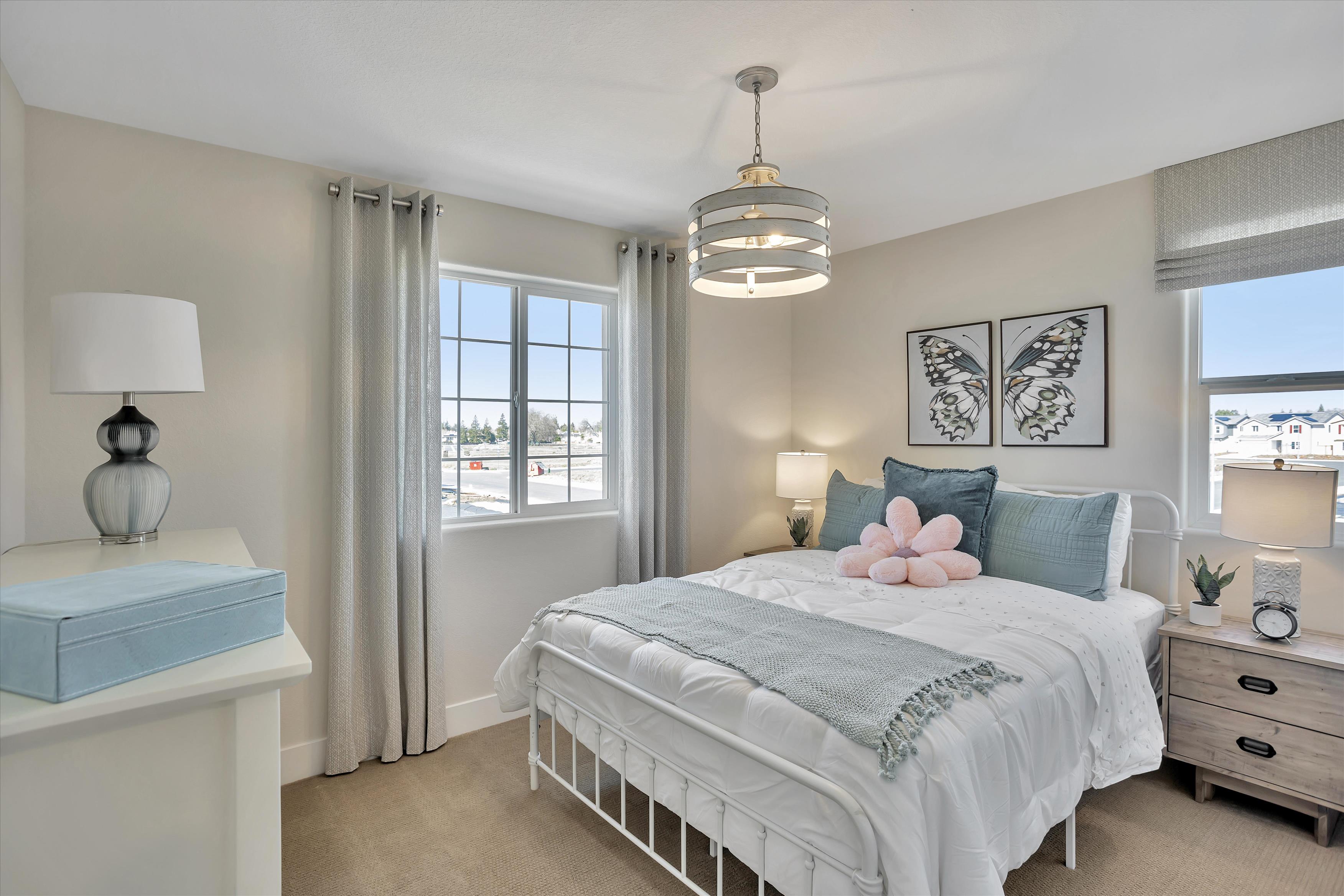 A bedroom with a bed and a window.