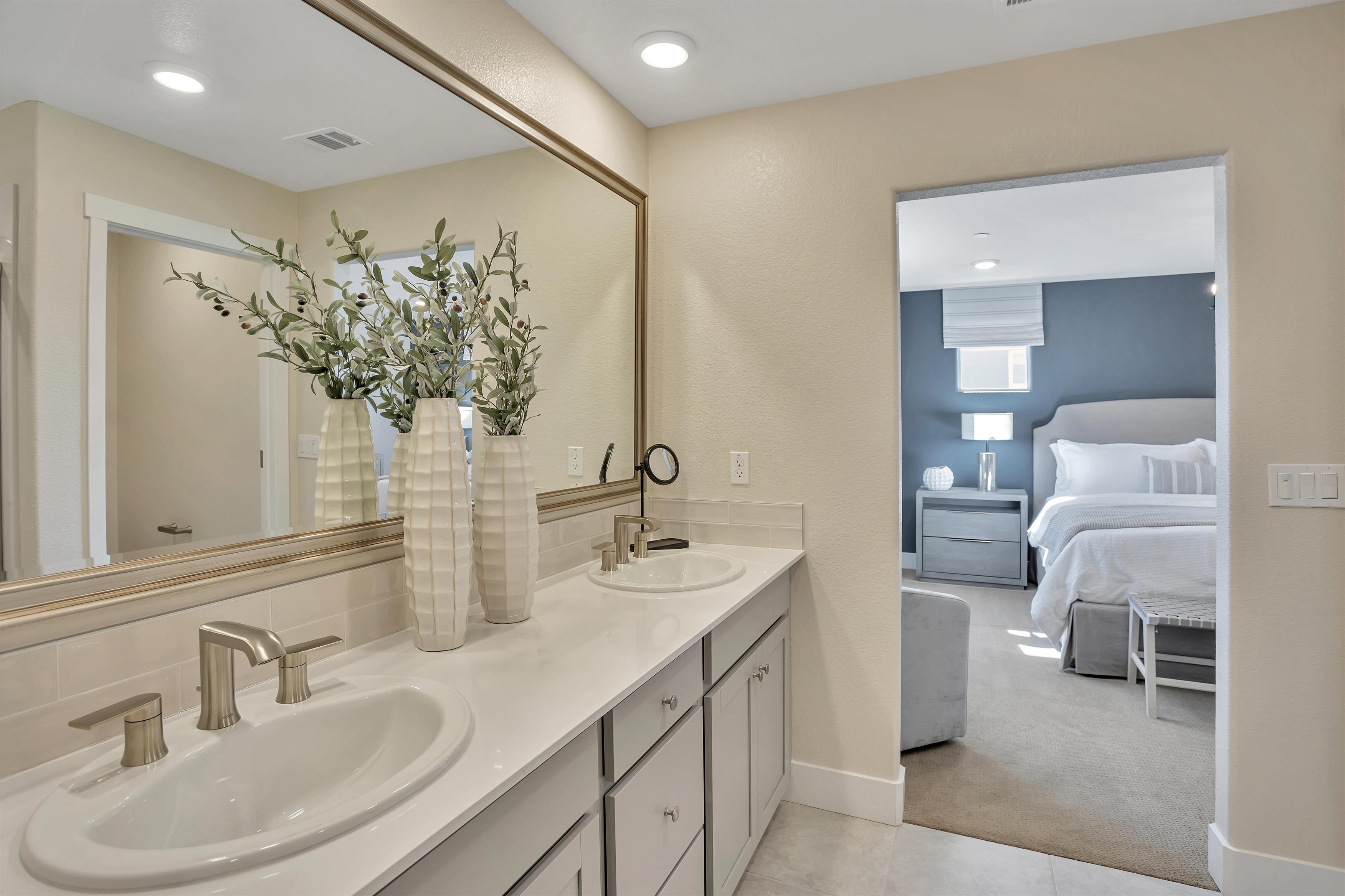 A bathroom with a large mirror.