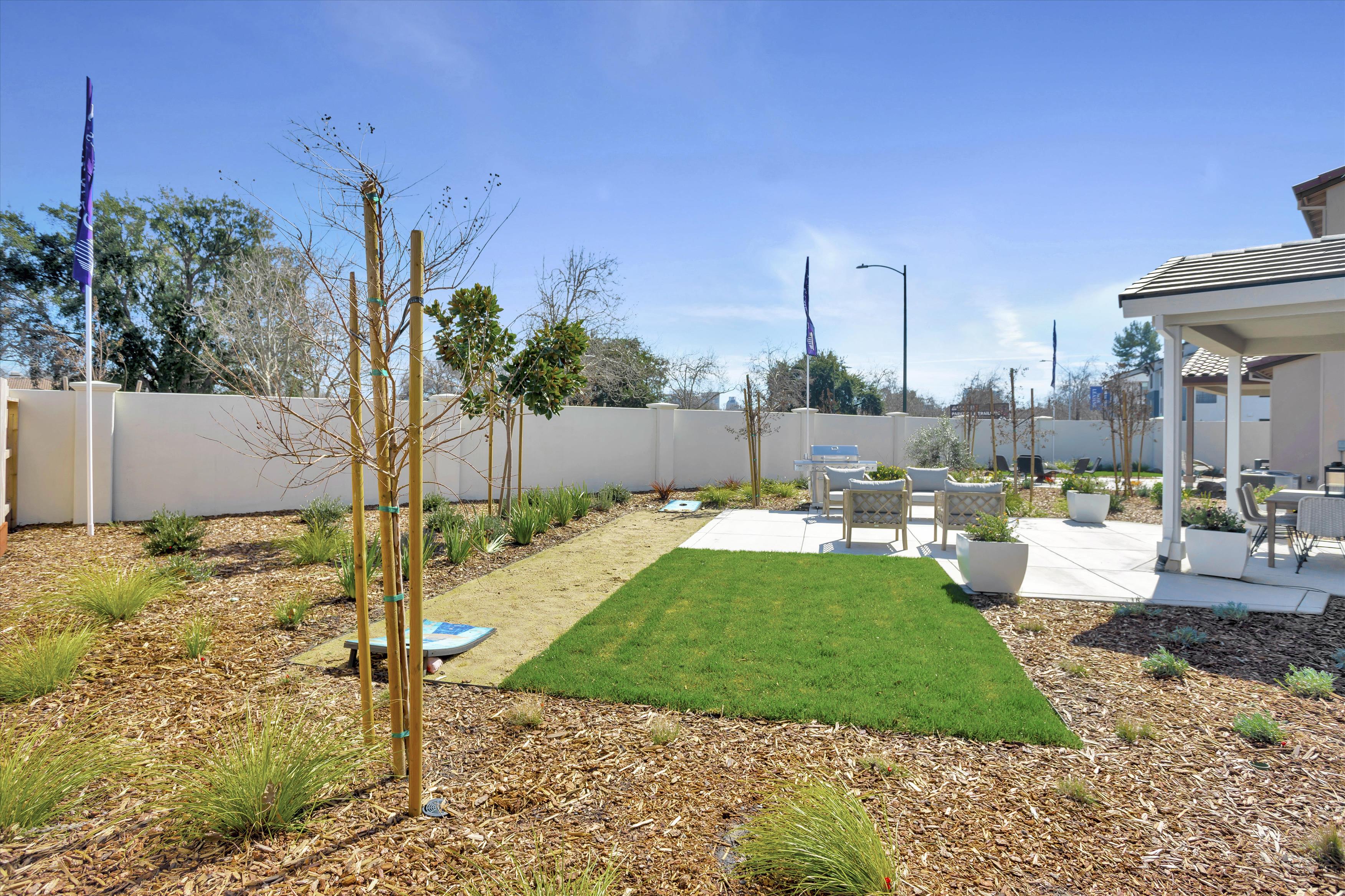 A backyard with a small pool.