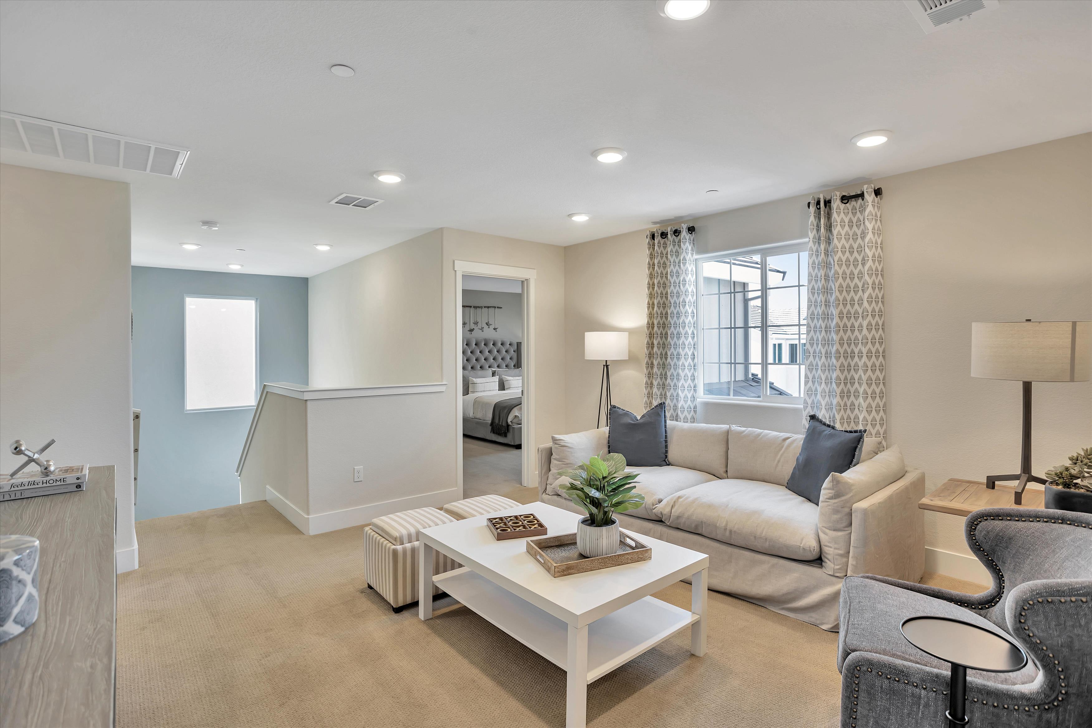 A living room with a couch and a table.