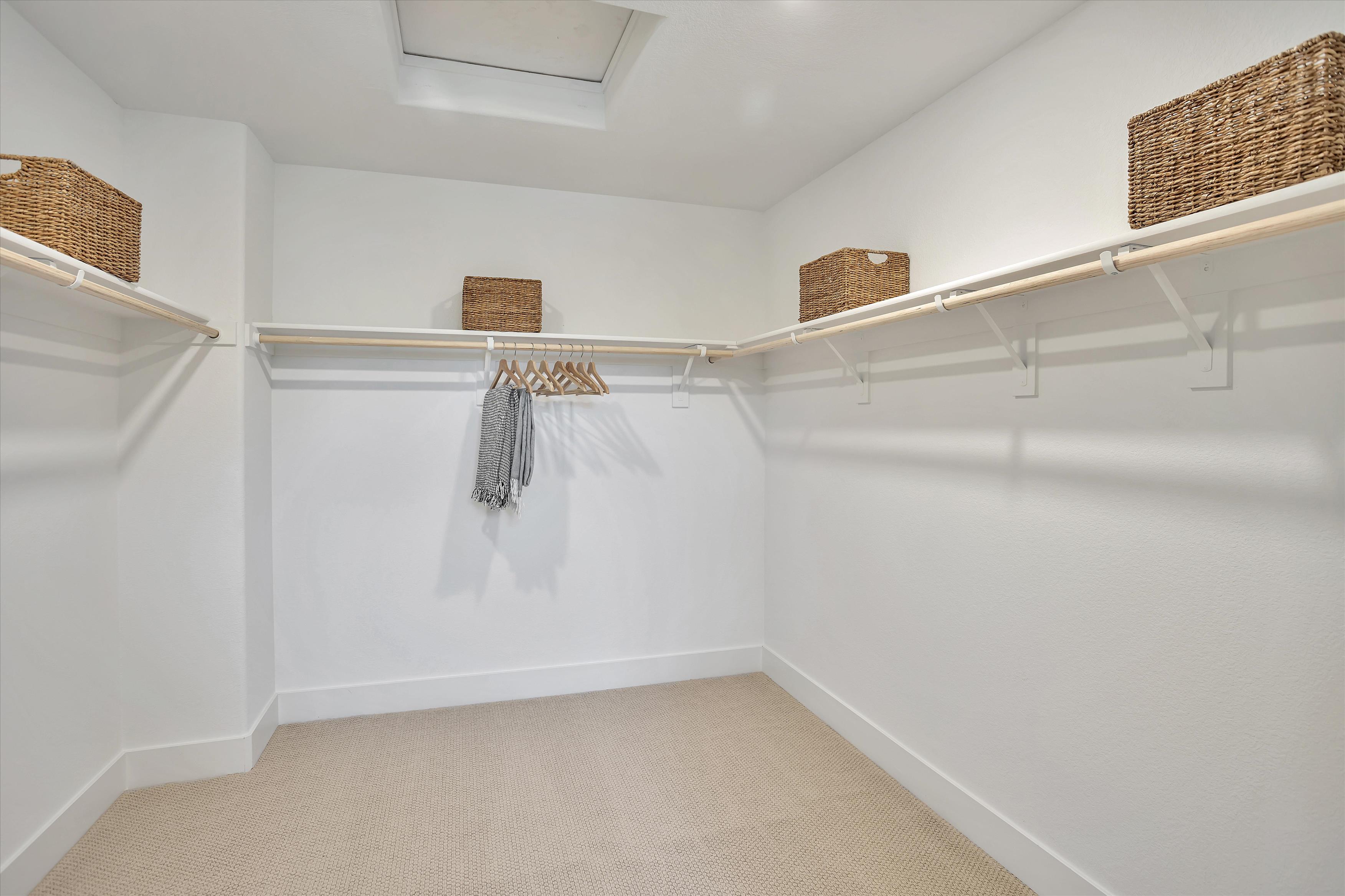 A white room with a white wall and a basket with a basket on it.